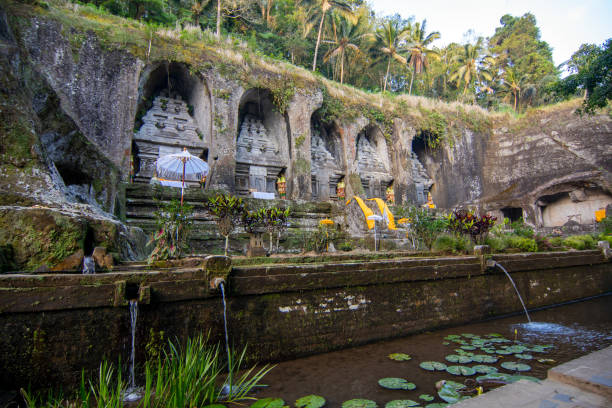 Bali Experience Tour-Gunung Kawi temple is an archaeological site located in Tampaksiring, Bali Island. Dating from the 11th century, the temple has a unique shape in the form of carvings on the sandstone walls on the Pakerisan river cliffs.
